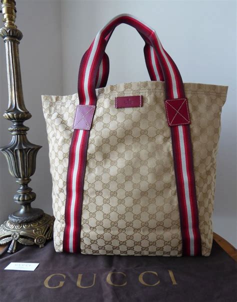 807706465 gucci|Large GG tote bag in beige and ebony GG canvas .